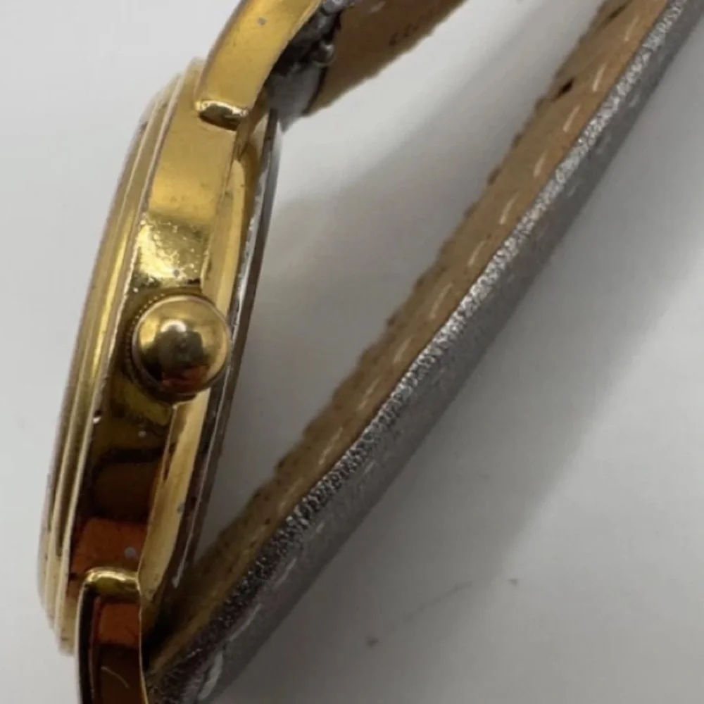 Guess Gold and Silver Quartz skeleton watch